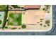 Drone image of a home's roof, backyard, and surroundings, featuring desert-style landscaping at 10521 W Donald Dr, Peoria, AZ 85383