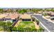 Birds eye view of a home with a well-maintained lawn, covered patio, and lovely landscaping at 10521 W Donald Dr, Peoria, AZ 85383