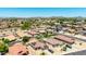 A neighborhood showing the house and others with manicured lawns and desert landscaping, and the mountains in the background at 10521 W Donald Dr, Peoria, AZ 85383