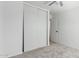 Bedroom featuring sliding door closet, neutral walls, and plush carpet at 10521 W Donald Dr, Peoria, AZ 85383