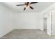 Bright bedroom with neutral paint, ceiling fan, and access to a spacious closet at 10521 W Donald Dr, Peoria, AZ 85383