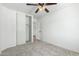 Bedroom featuring neutral walls, carpet, and a double door closet at 10521 W Donald Dr, Peoria, AZ 85383