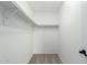 Large walk-in closet with ample shelving and a neutral carpeted floor at 10521 W Donald Dr, Peoria, AZ 85383