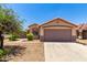 Single-story home featuring a neutral color scheme, a tile roof, and a two-car garage at 10521 W Donald Dr, Peoria, AZ 85383