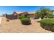 Manicured front yard featuring desert landscaping, mature trees, and a walkway to the entrance at 10521 W Donald Dr, Peoria, AZ 85383