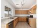Kitchen featuring light wood cabinets, stone countertops, and stainless steel appliances at 10521 W Donald Dr, Peoria, AZ 85383