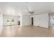 Spacious living room with tile flooring, ceiling fan, and a view of the backyard at 10521 W Donald Dr, Peoria, AZ 85383