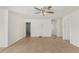Bright living room with tile floors, ceiling fan, and neutral paint, offering versatile layout options at 10521 W Donald Dr, Peoria, AZ 85383