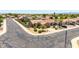 A well-maintained home is highlighted with mature trees, a two-car garage, and desert-friendly landscaping at 10521 W Donald Dr, Peoria, AZ 85383