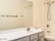 Bright bathroom featuring a shower, toilet, and modern vanity with a large mirror at 10722 W Quartz Dr, Casa Grande, AZ 85193