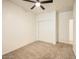 Carpeted bedroom has a closet and a ceiling fan with light at 10722 W Quartz Dr, Casa Grande, AZ 85193
