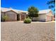 Charming single-story home featuring a desert landscaped yard and a two-car garage at 10722 W Quartz Dr, Casa Grande, AZ 85193