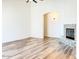 Spacious living room showcasing a fireplace and wood-look flooring at 10722 W Quartz Dr, Casa Grande, AZ 85193