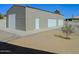 Large metal shed with multiple garage doors for storing vehicles or equipment at 10722 W Quartz Dr, Casa Grande, AZ 85193
