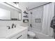 This bathroom features a tub and shower combo, a modern mirror, and floating shelves at 11224 W Puget Ave, Peoria, AZ 85345