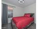 This bedroom boasts a cozy bed, neutral walls, and bright light from the window at 11224 W Puget Ave, Peoria, AZ 85345