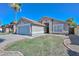 Charming single-story home with a well-manicured front yard and attached two-car garage on a sunny day at 11224 W Puget Ave, Peoria, AZ 85345
