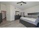 Primary bedroom with vaulted ceilings, dark furniture, gray floors and neutral color palette at 11224 W Puget Ave, Peoria, AZ 85345