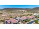 Aerial view showcasing the tile roofs and desert landscape surrounding luxury homes in a picturesque neighborhood at 11796 W Creosote Dr, Peoria, AZ 85383