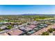 Beautiful aerial view showcasing luxury community homes, golf course, and mountain views at 11796 W Creosote Dr, Peoria, AZ 85383