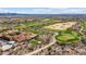 Expansive aerial view of the estate showcasing the lush golf course and tile roof home at 11796 W Creosote Dr, Peoria, AZ 85383
