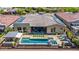 Expansive backyard with pool, spa, covered patio, and desert landscaping, perfect for outdoor living at 11796 W Creosote Dr, Peoria, AZ 85383