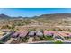 Desert homes featuring tile roofs, solar panels, and desert landscaping in an exclusive community at 11796 W Creosote Dr, Peoria, AZ 85383