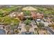 Overhead shot of the grand home featuring a circular driveway and a golf course in the background at 11796 W Creosote Dr, Peoria, AZ 85383