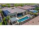 Large backyard including a pool, spa, outdoor kitchen, covered patios, and desert landscaping at 11796 W Creosote Dr, Peoria, AZ 85383
