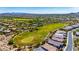 Overhead shot of a verdant golf course surrounded by desert landscape and luxurious homes at 11796 W Creosote Dr, Peoria, AZ 85383