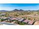 Scenic aerial view of luxury homes with desert landscaping and mountain backdrop in a beautiful community at 11796 W Creosote Dr, Peoria, AZ 85383