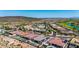 Stunning aerial view of luxury homes with pools nestled within a scenic desert community and distant mountains at 11796 W Creosote Dr, Peoria, AZ 85383