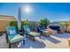A backyard patio offering comfortable seating and a firepit at 11796 W Creosote Dr, Peoria, AZ 85383