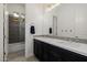 Bathroom featuring a double vanity with dark cabinetry and modern fixtures at 11796 W Creosote Dr, Peoria, AZ 85383