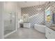 A bright bathroom with modern fixtures, tub, and glass shower at 11796 W Creosote Dr, Peoria, AZ 85383