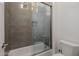 Bathroom with a tiled shower and tub combination, perfect for relaxation at 11796 W Creosote Dr, Peoria, AZ 85383