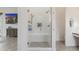 Modern bathroom featuring a glass shower with white subway tile and built-in bench at 11796 W Creosote Dr, Peoria, AZ 85383