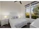 Bright bedroom with large windows showcasing outdoor views and a comfortable bed at 11796 W Creosote Dr, Peoria, AZ 85383