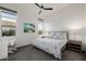 Cozy bedroom with neutral tones, a ceiling fan, and windows offering natural light at 11796 W Creosote Dr, Peoria, AZ 85383