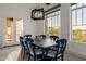 Bright dining area featuring modern lighting fixture and mountain views at 11796 W Creosote Dr, Peoria, AZ 85383