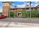Close up of the charming gated entrance covered in ivy and lush landscaping at 11796 W Creosote Dr, Peoria, AZ 85383