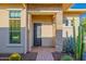 Front door view with desert landscaping on a brick walkway, and a stone entryway at 11796 W Creosote Dr, Peoria, AZ 85383