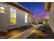 Attractive desert-landscaped front yard with a brick walkway lined with barrel cactus leading to the home's entrance at 11796 W Creosote Dr, Peoria, AZ 85383