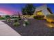 Front yard featuring native desert landscaping and a modern home exterior at twilight at 11796 W Creosote Dr, Peoria, AZ 85383