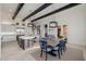 Bright kitchen and dining area featuring a center island with bar seating at 11796 W Creosote Dr, Peoria, AZ 85383