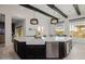 Kitchen island with stainless steel dishwasher and farmhouse sink at 11796 W Creosote Dr, Peoria, AZ 85383