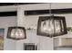 Modern kitchen lights hanging above a kitchen island at 11796 W Creosote Dr, Peoria, AZ 85383