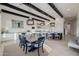 Open kitchen and dining area featuring a large island, pendant lights, and white cabinetry at 11796 W Creosote Dr, Peoria, AZ 85383