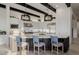 Island kitchen featuring a breakfast bar with elegant light blue cushioned stools at 11796 W Creosote Dr, Peoria, AZ 85383