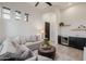 Inviting living room featuring a sectional sofa, wet bar, and modern decor at 11796 W Creosote Dr, Peoria, AZ 85383